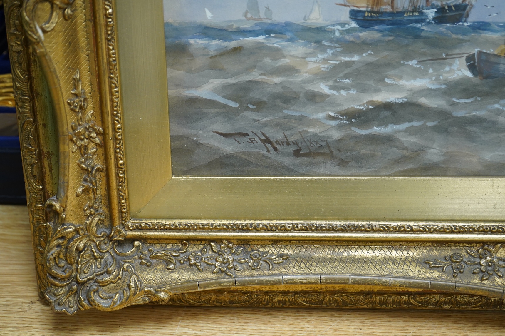 Thomas Bush Hardy (1842-1897), Maritime scene with ships and rowing boats, signed and dated 1887, watercolour heightened with white, 28 x 60cm, ornate gilt frame